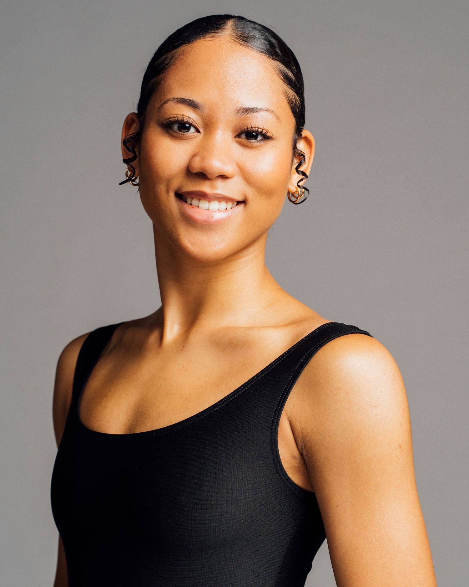 Refined Chicago dancer headshot photography capturing beautiful young black ballerina dancer in classical pose for company audition.