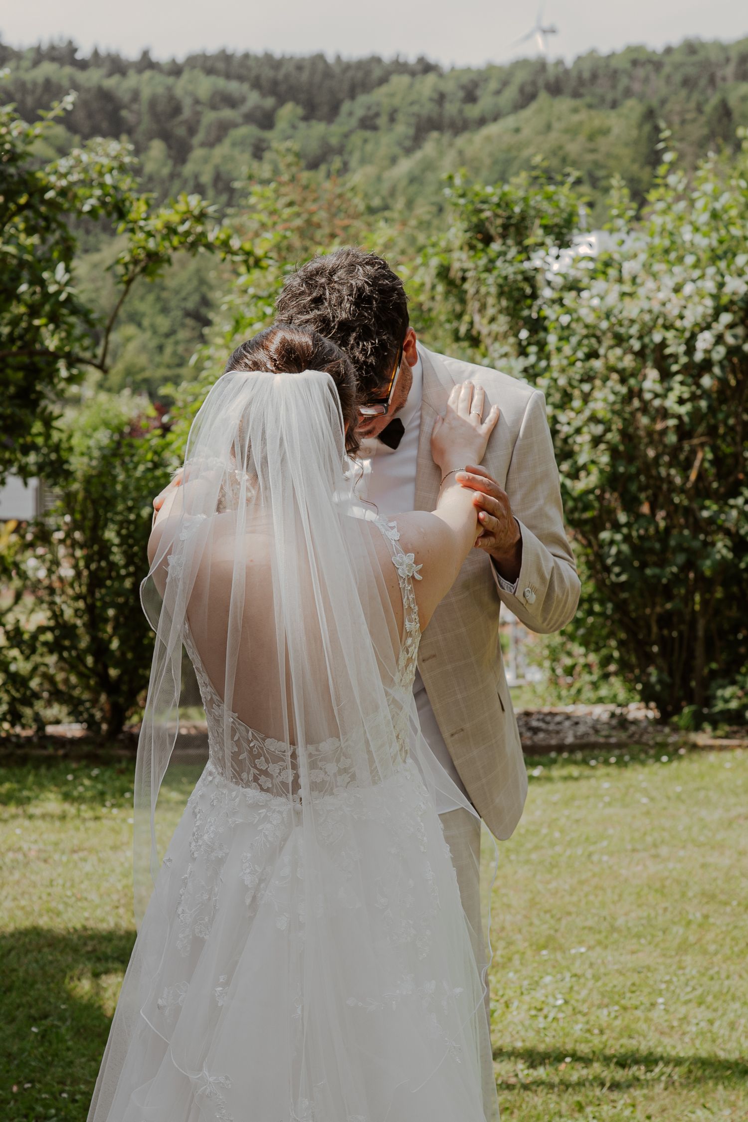 A romantic couple shares intimate moments in a series of tender close-up shots wearing cream colored sweaters.