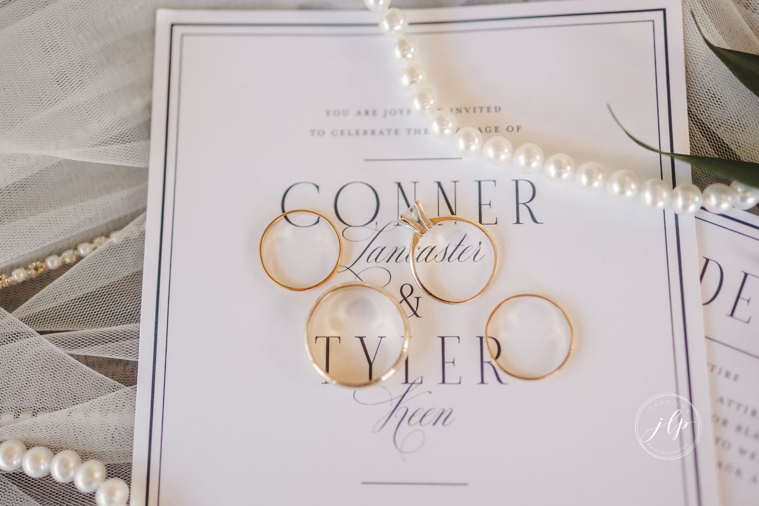 Wedding invitation with classic typography showing names Conner and Tyler in elegant script.