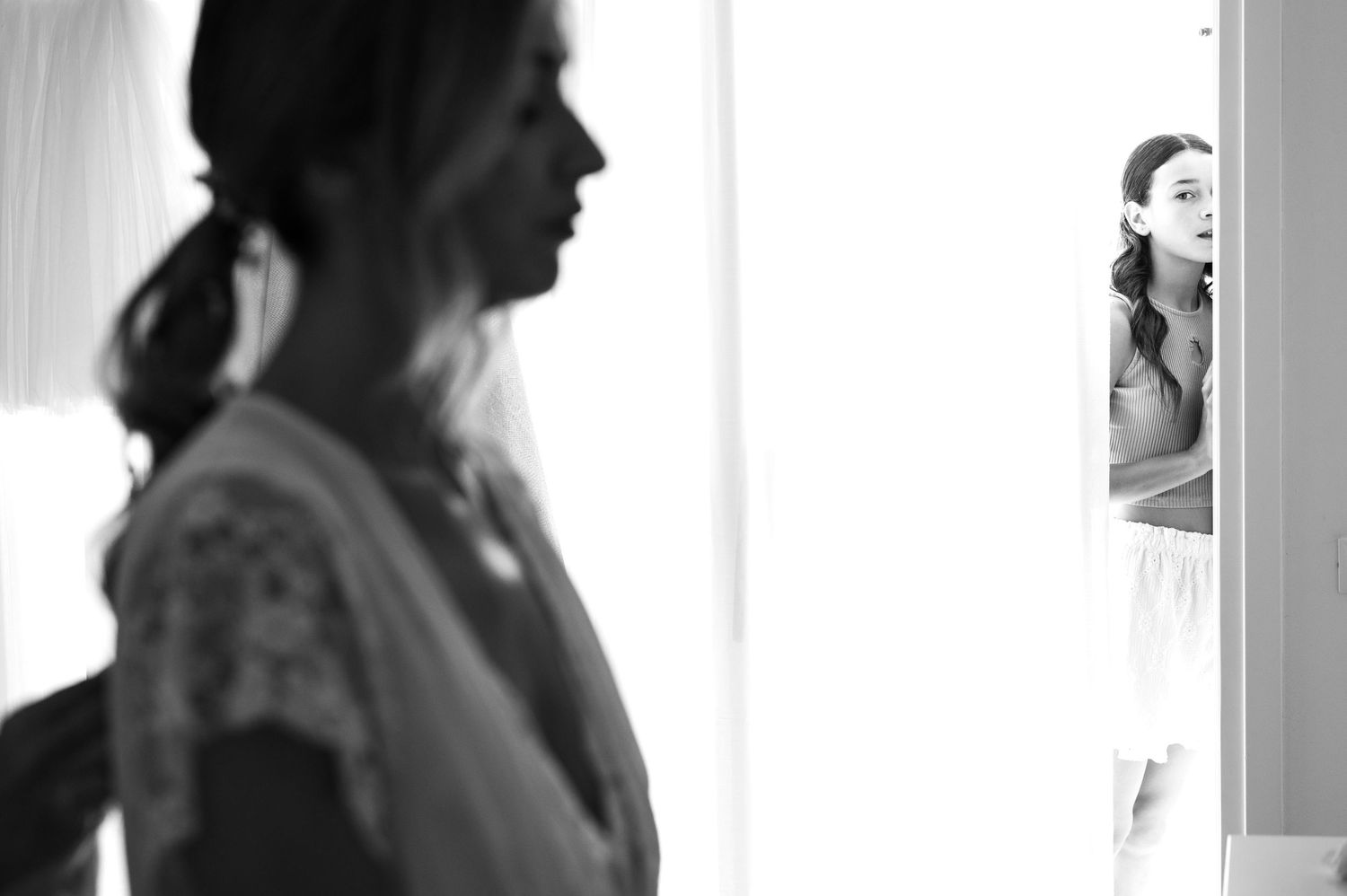 Black and white getting ready sequence showing morning wedding preparations.