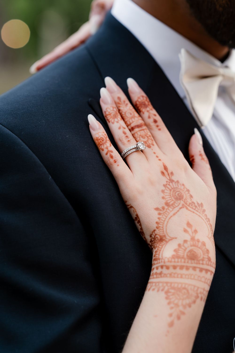First look in British wedding outfits — bride in Pronovias gown, groom in tuxedo, fusion wedding photography