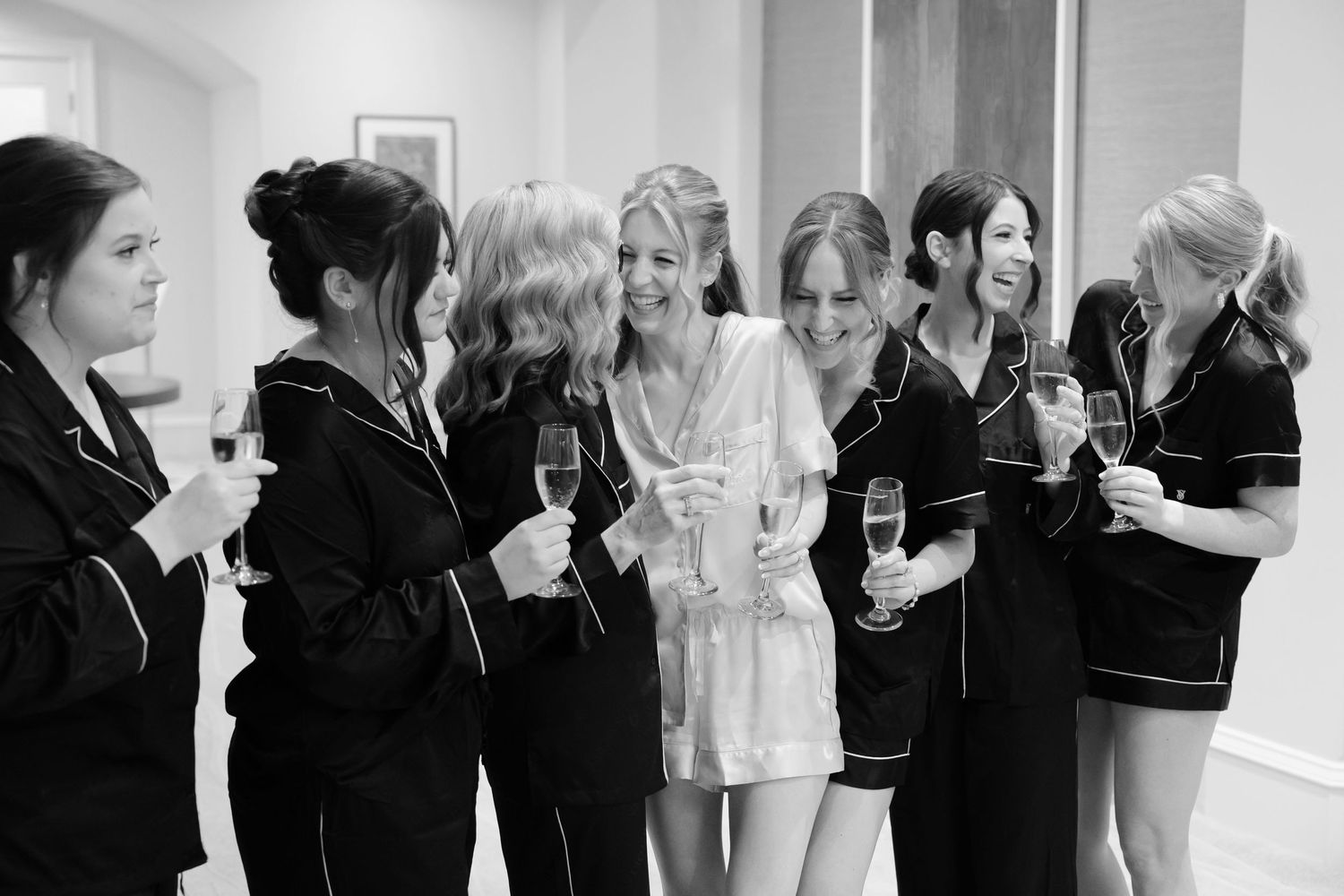Bride toasting with bridesmaids at BallenIsles Country Club in Palm Beach during a wedding photographed by Ohio photographer Tom Forrest.