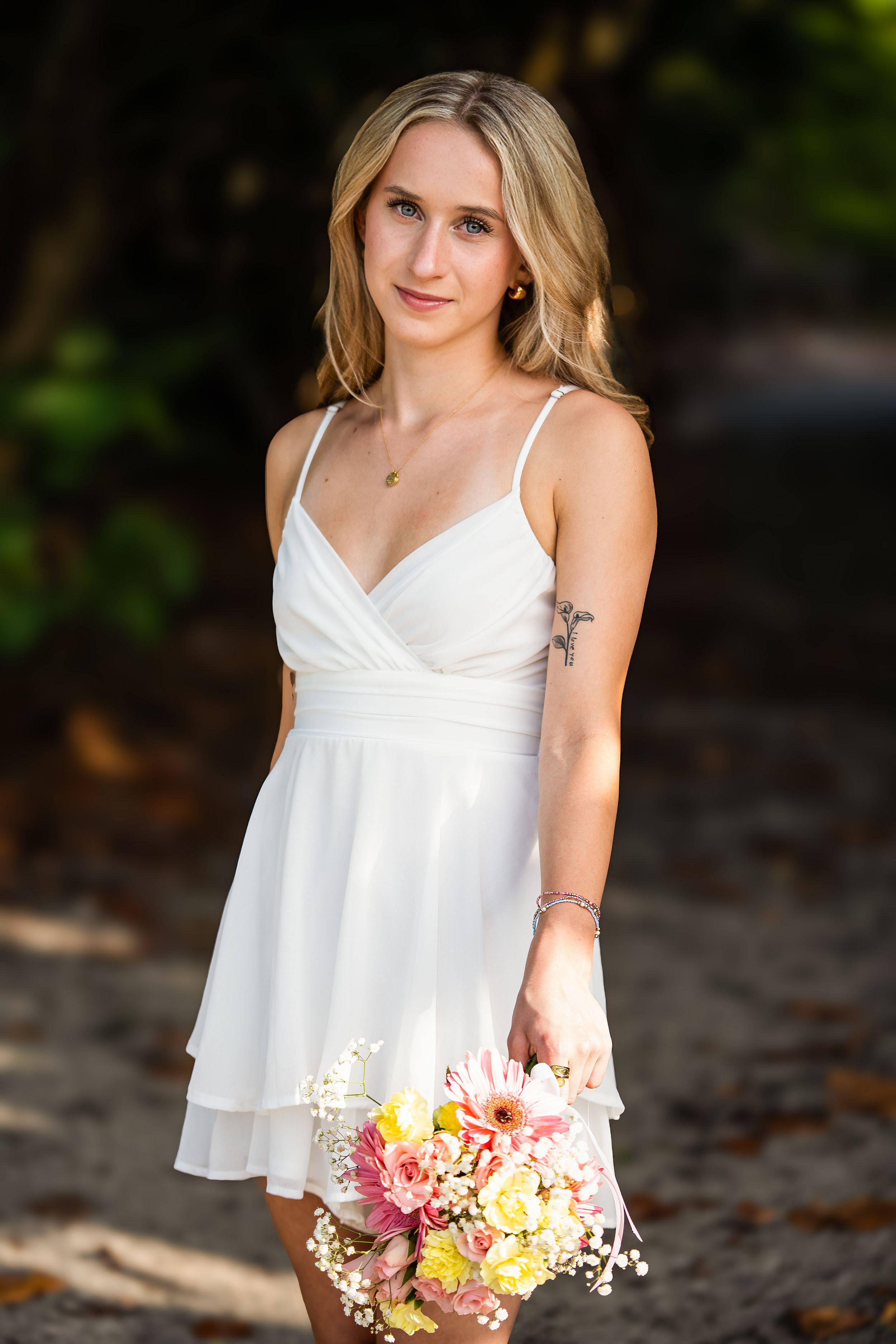 Amelia, senior and high school graduate client, posing for individual portraits in DuBois Park, Jupiter, Florida of Palm Beach County