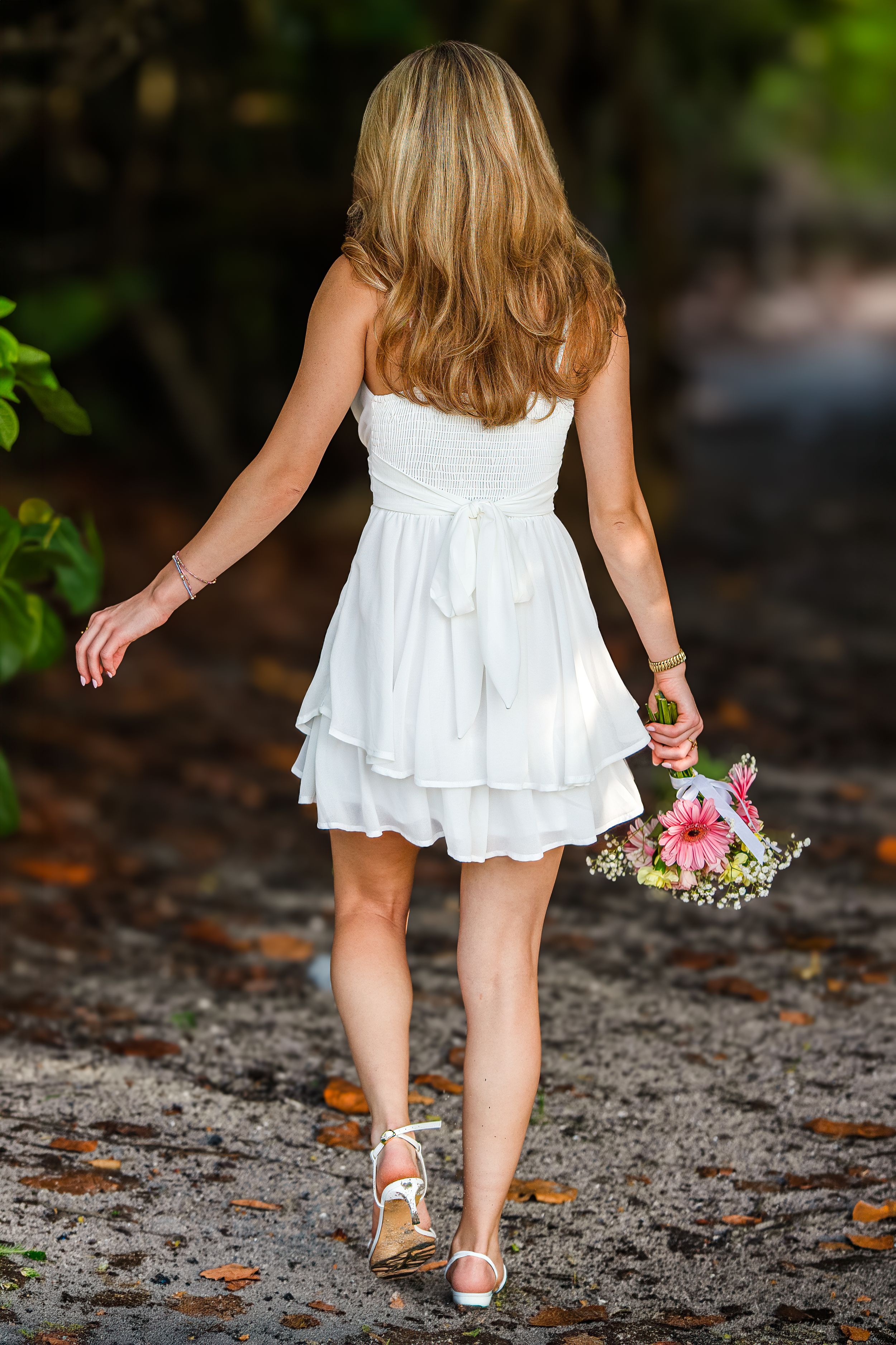 Amelia, senior and high school graduate client, posing for individual portraits in DuBois Park, Jupiter, Florida of Palm Beach County