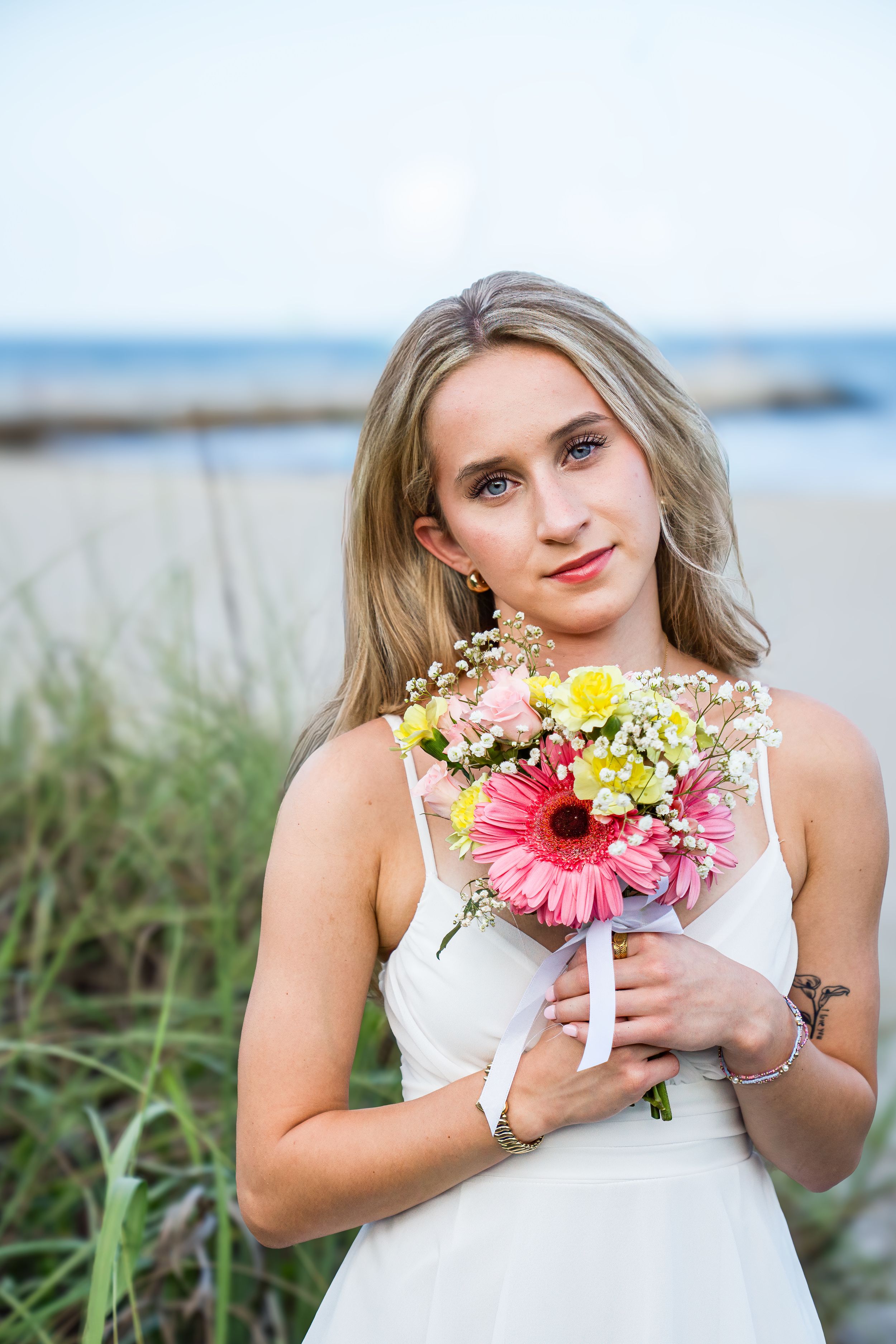 Amelia, senior and high school graduate client, posing for individual portraits in DuBois Park, Jupiter, Florida of Palm Beach County
