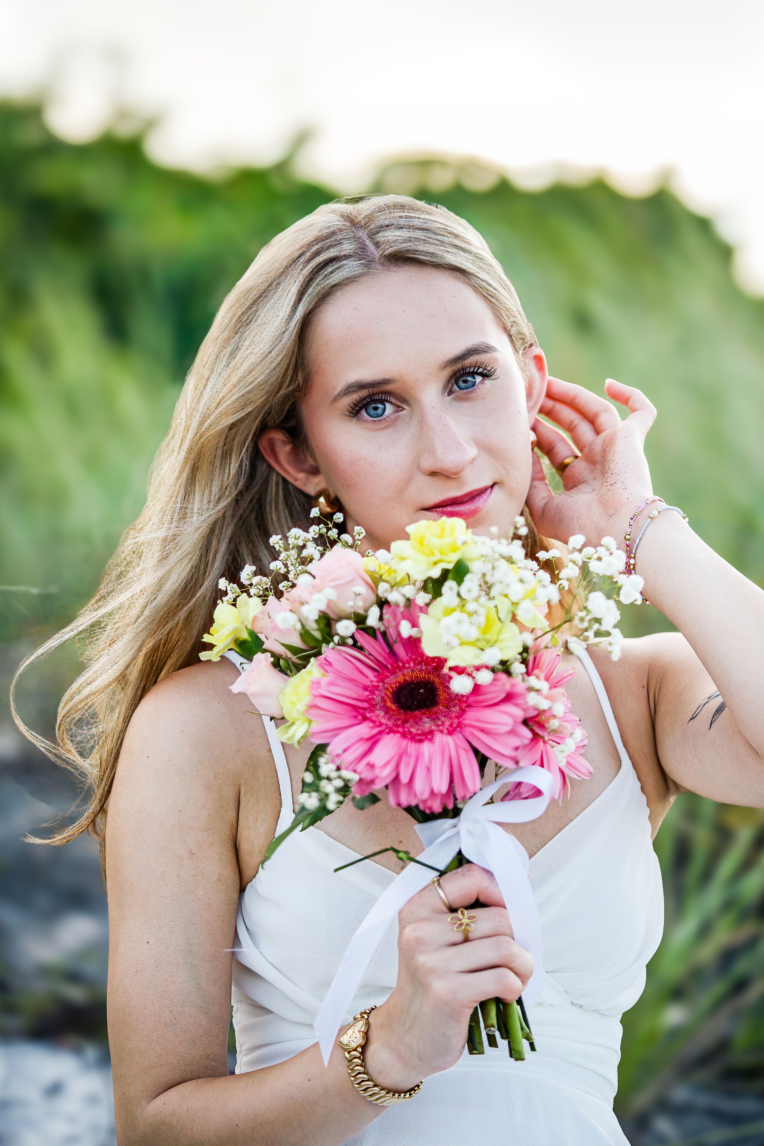Amelia, senior and high school graduate client, posing for individual portraits in DuBois Park, Jupiter, Florida of Palm Beach County