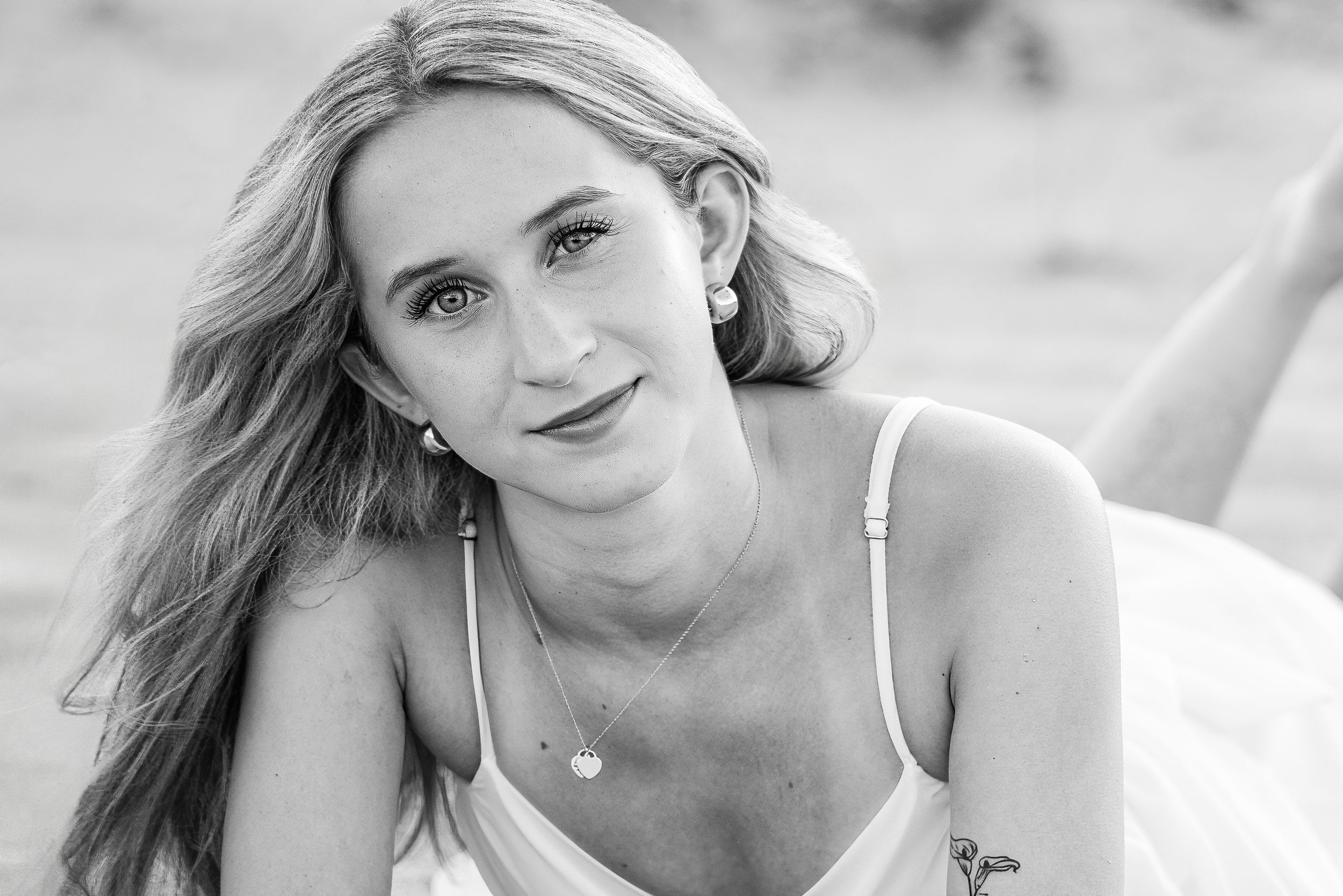 Amelia, senior and high school graduate client, posing for individual portraits in DuBois Park, Jupiter, Florida of Palm Beach County