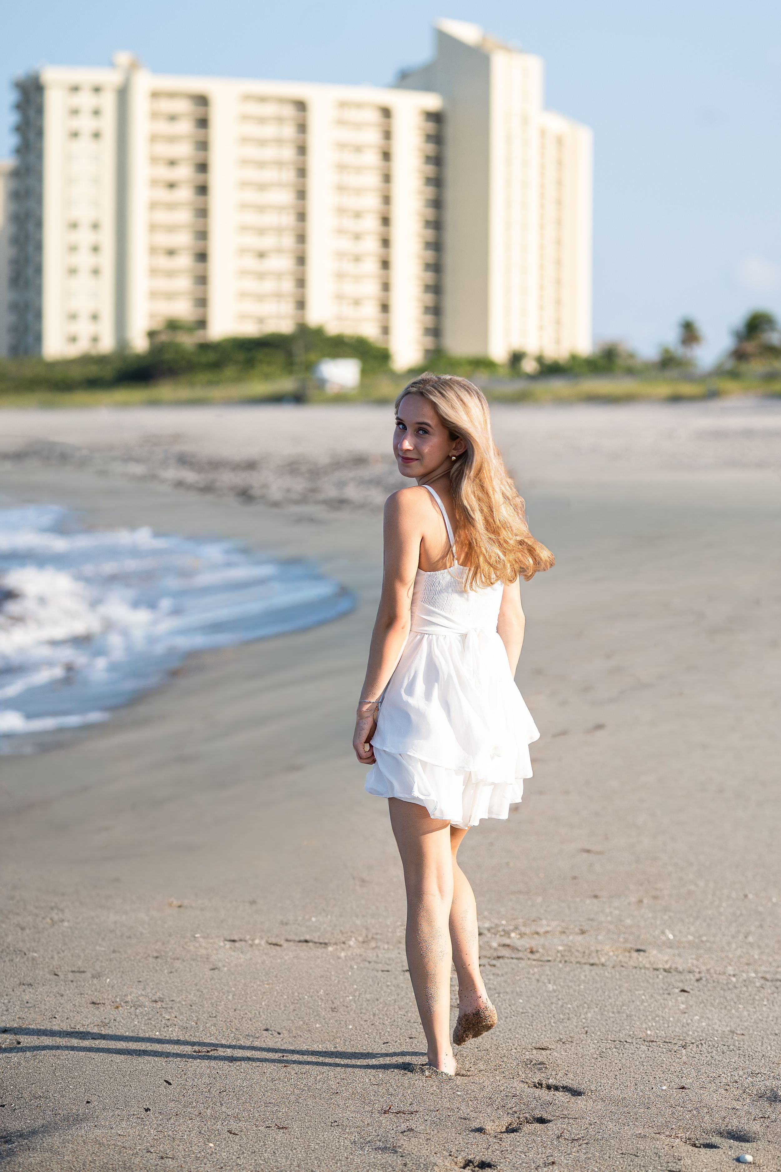 Amelia, senior and high school graduate client, posing for individual portraits in DuBois Park, Jupiter, Florida of Palm Beach County