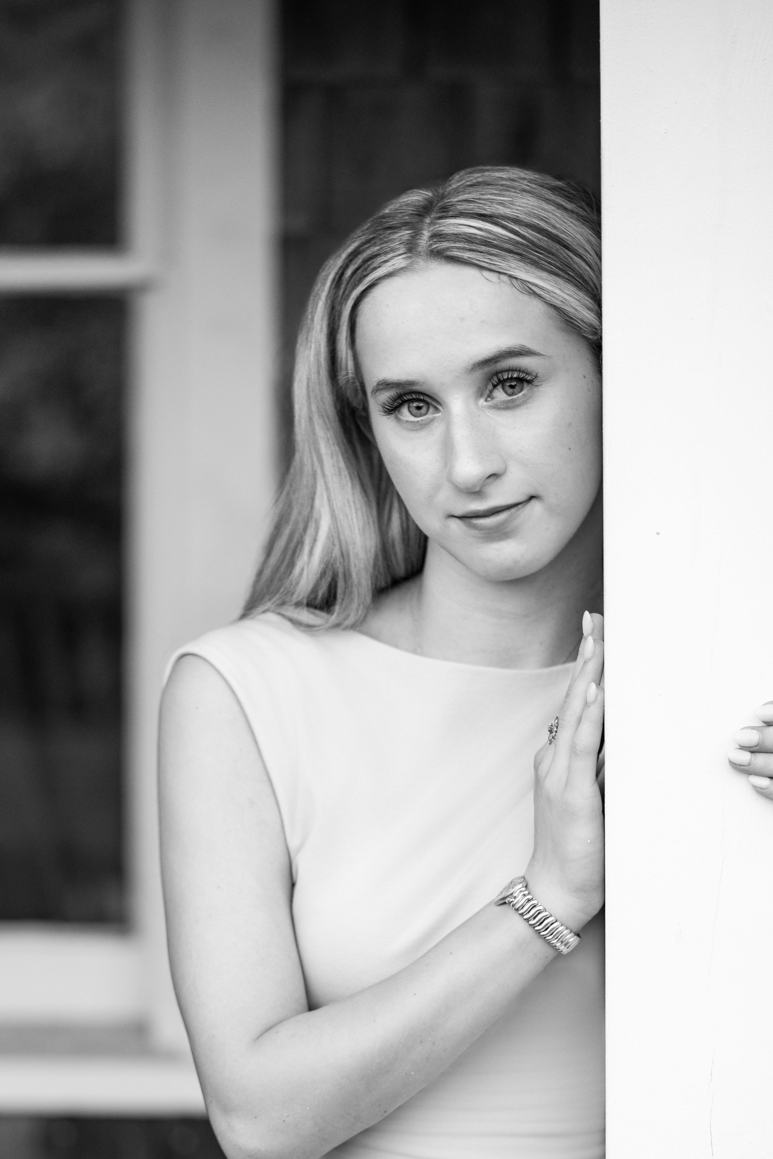 Amelia, senior and high school graduate client, posing for individual portraits in DuBois Park, Jupiter, Florida of Palm Beach County