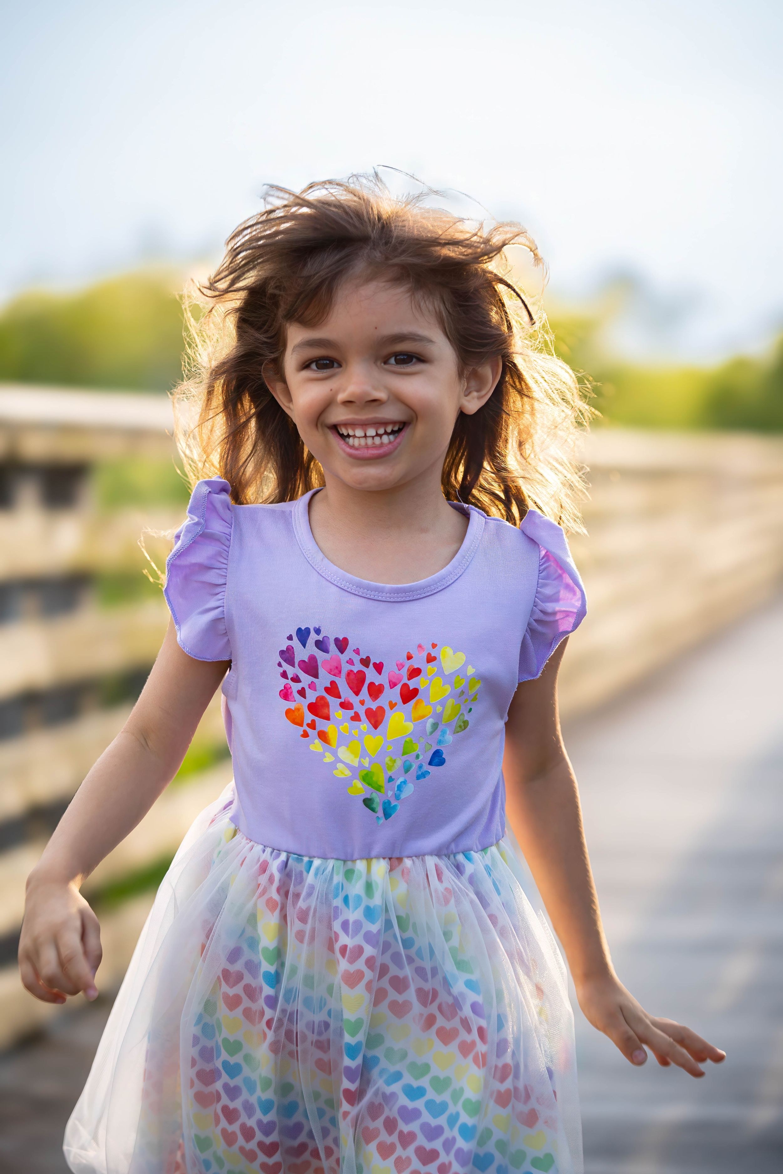 evelyn  playing on the boardwalk of juno dunes natural area during a family session in juno beach florida