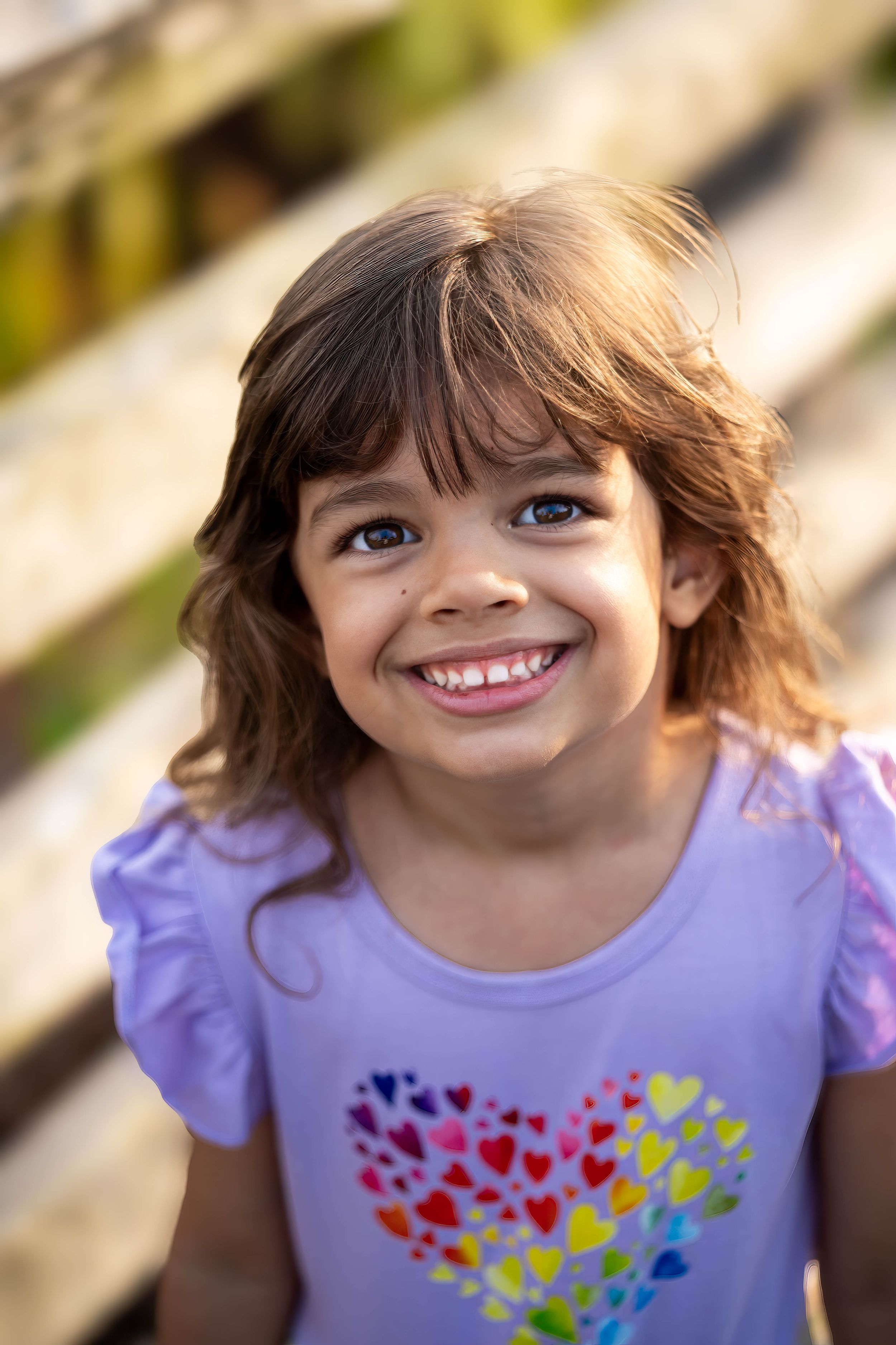 evelyn playing on the boardwalk of juno dunes natural area during a family session in juno beach florida