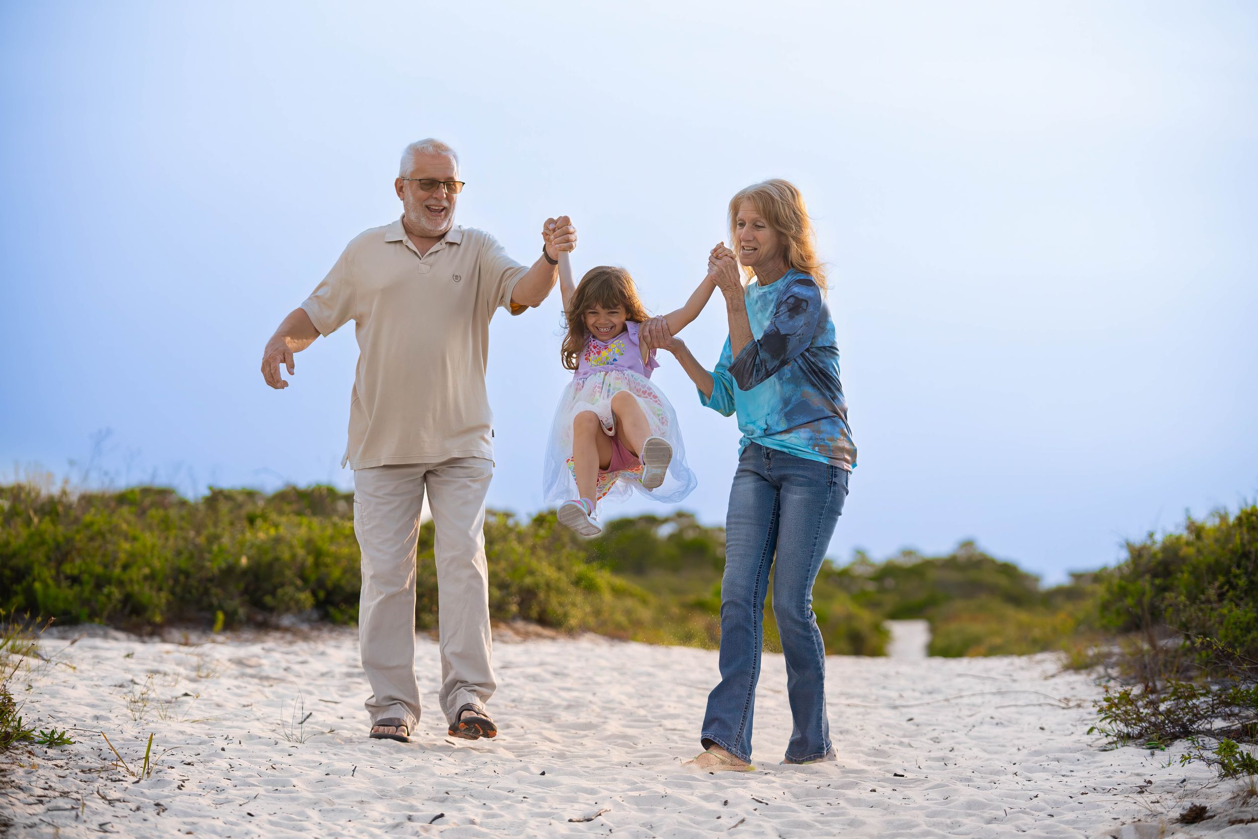 Gina , Michael and Evelyn  together in juno dunes natural area, juno beach florida, during a family session