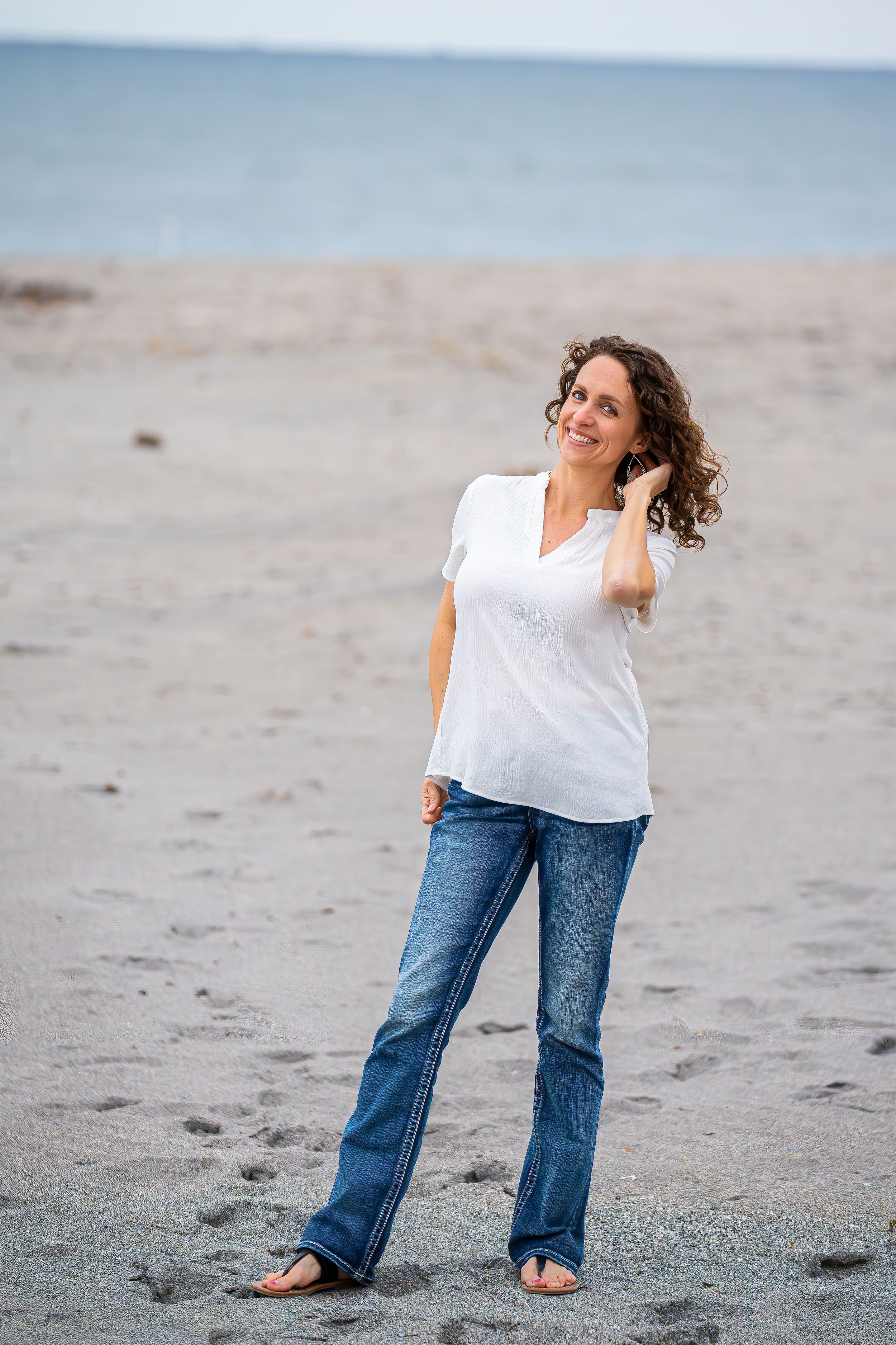 Casey Thomas photography posing on the beach of DuBois park in Jupiter, Florida.