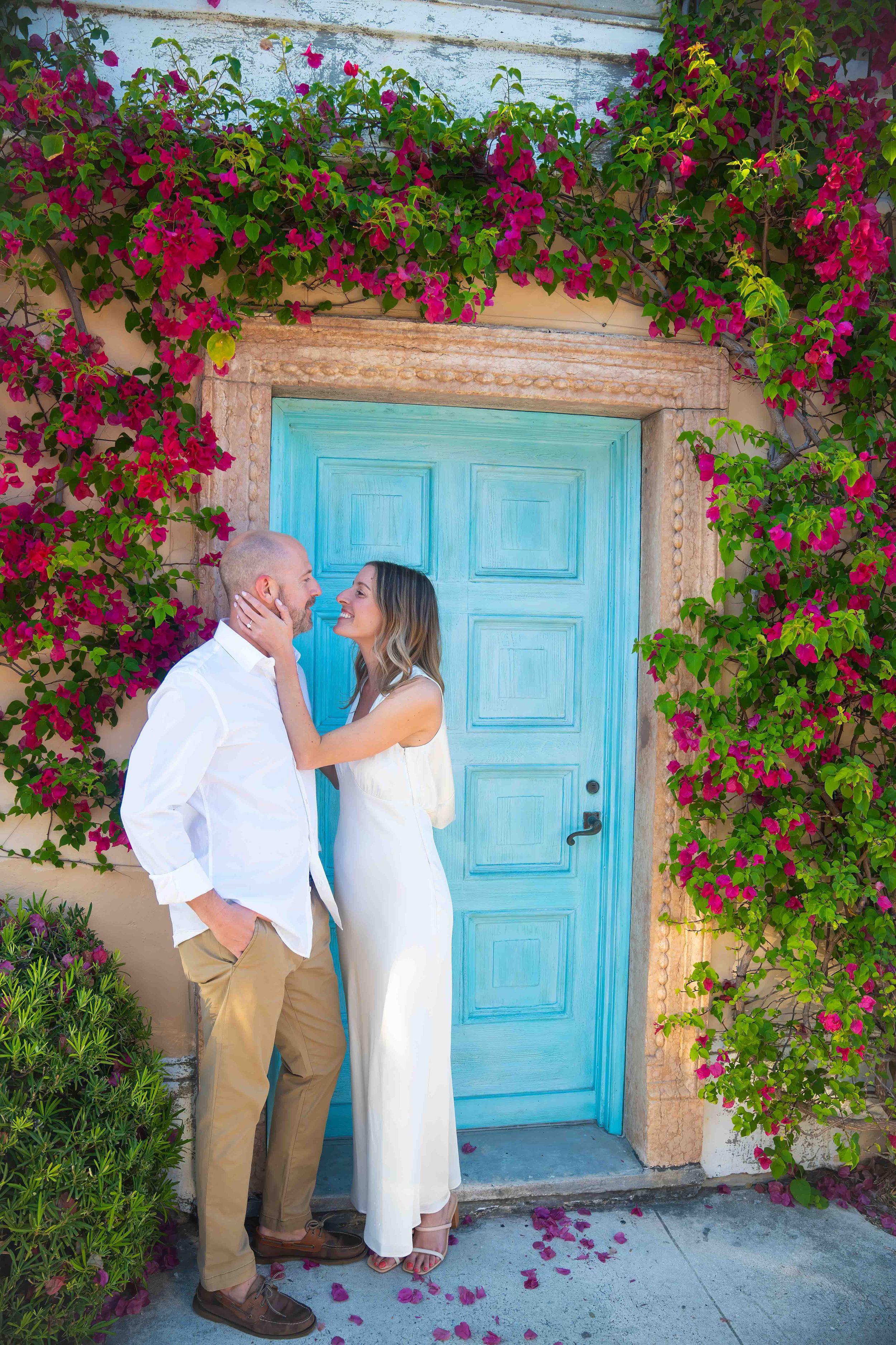 Kari and Jeff standing in worth ave, west palm beach florida, during an engagement couples session