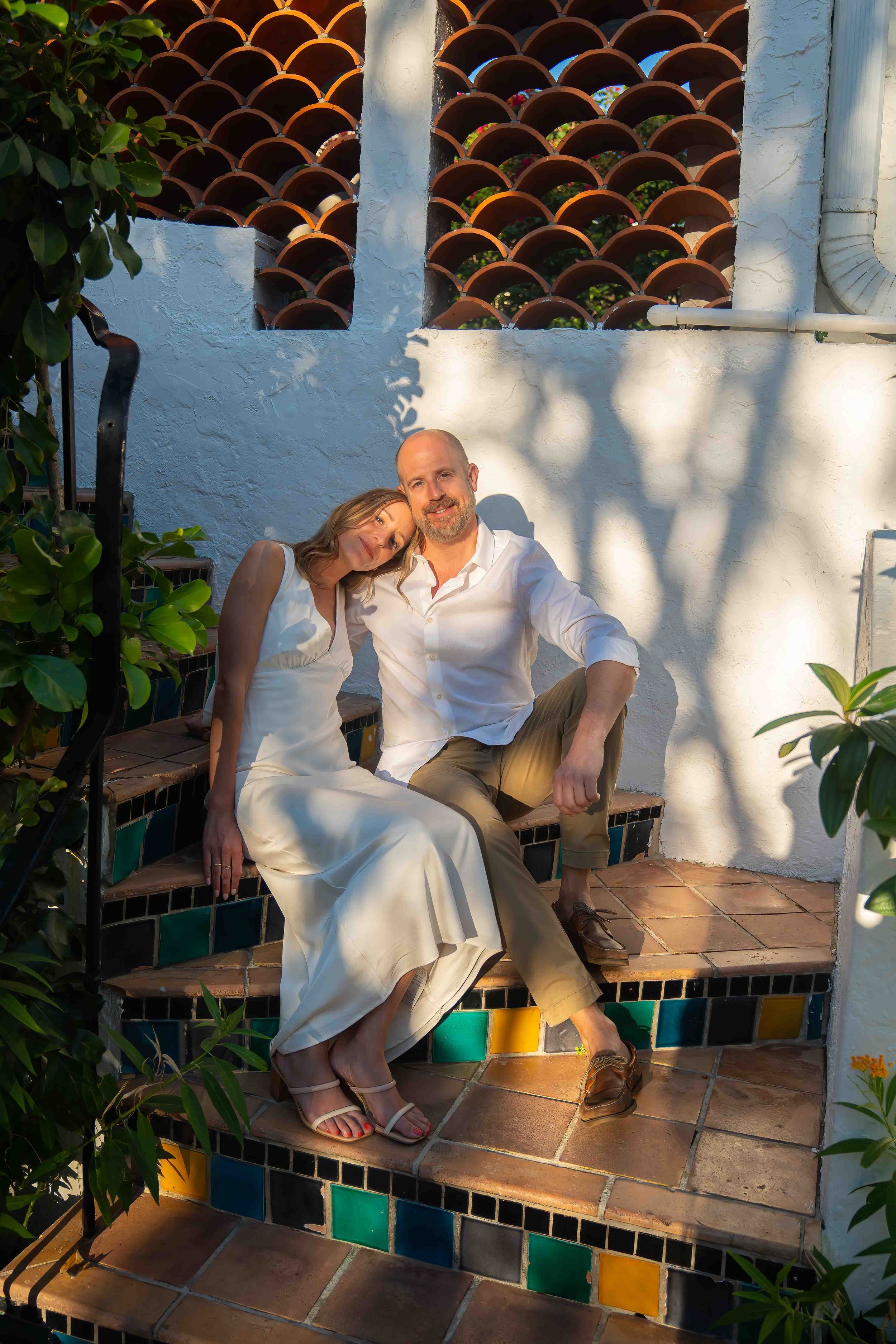 Kari and Jeff standing in worth ave, west palm beach florida, during an engagement couples session
