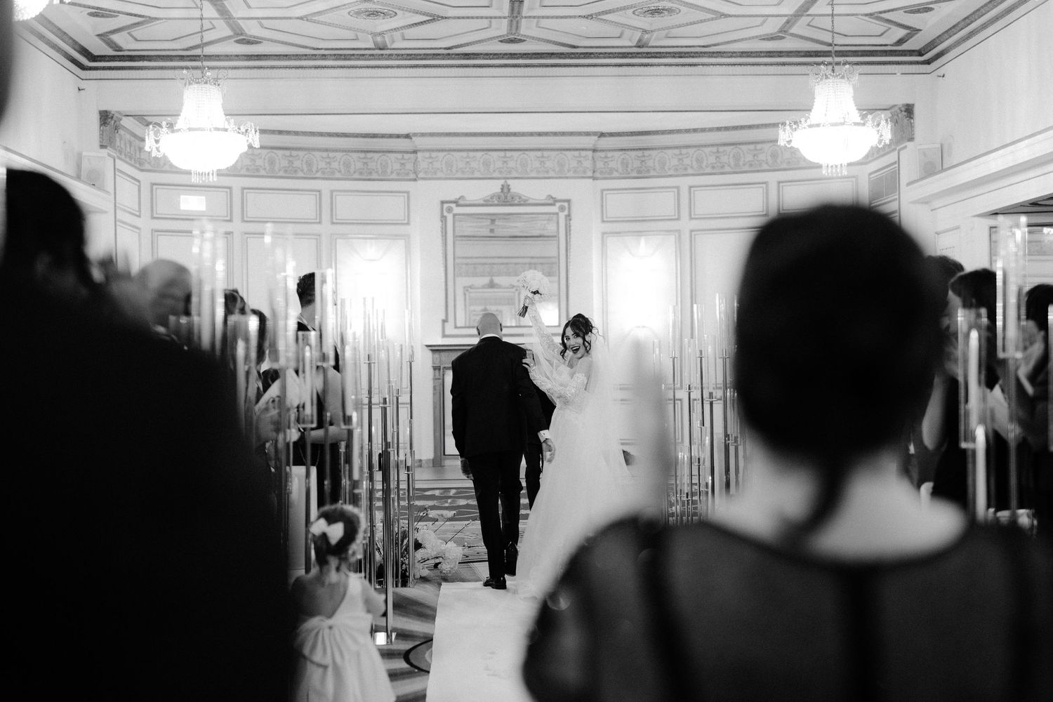 Black and white film strip showing vintage hallway scenes with dramatic lighting and architectural details.