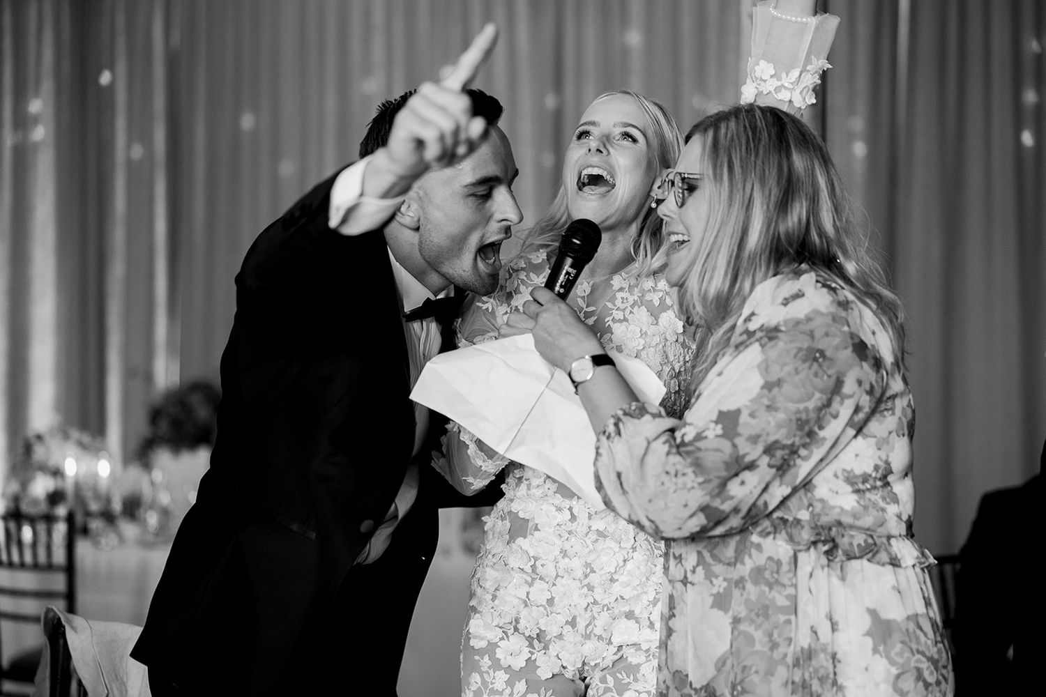 Bride and groom share a joyful dance moment at their wedding reception.