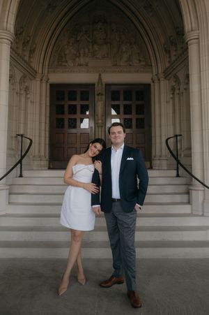A couple poses playfully in a series of four photos under an ornate stone archway.