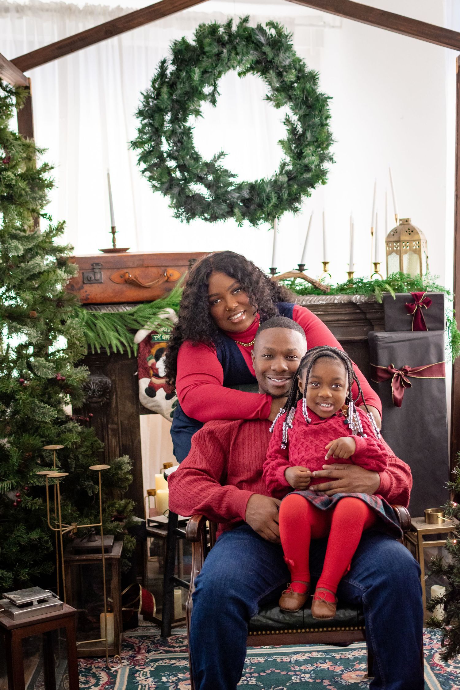 Family Christmas portraits in Tacoma studio with evergreen forest decor