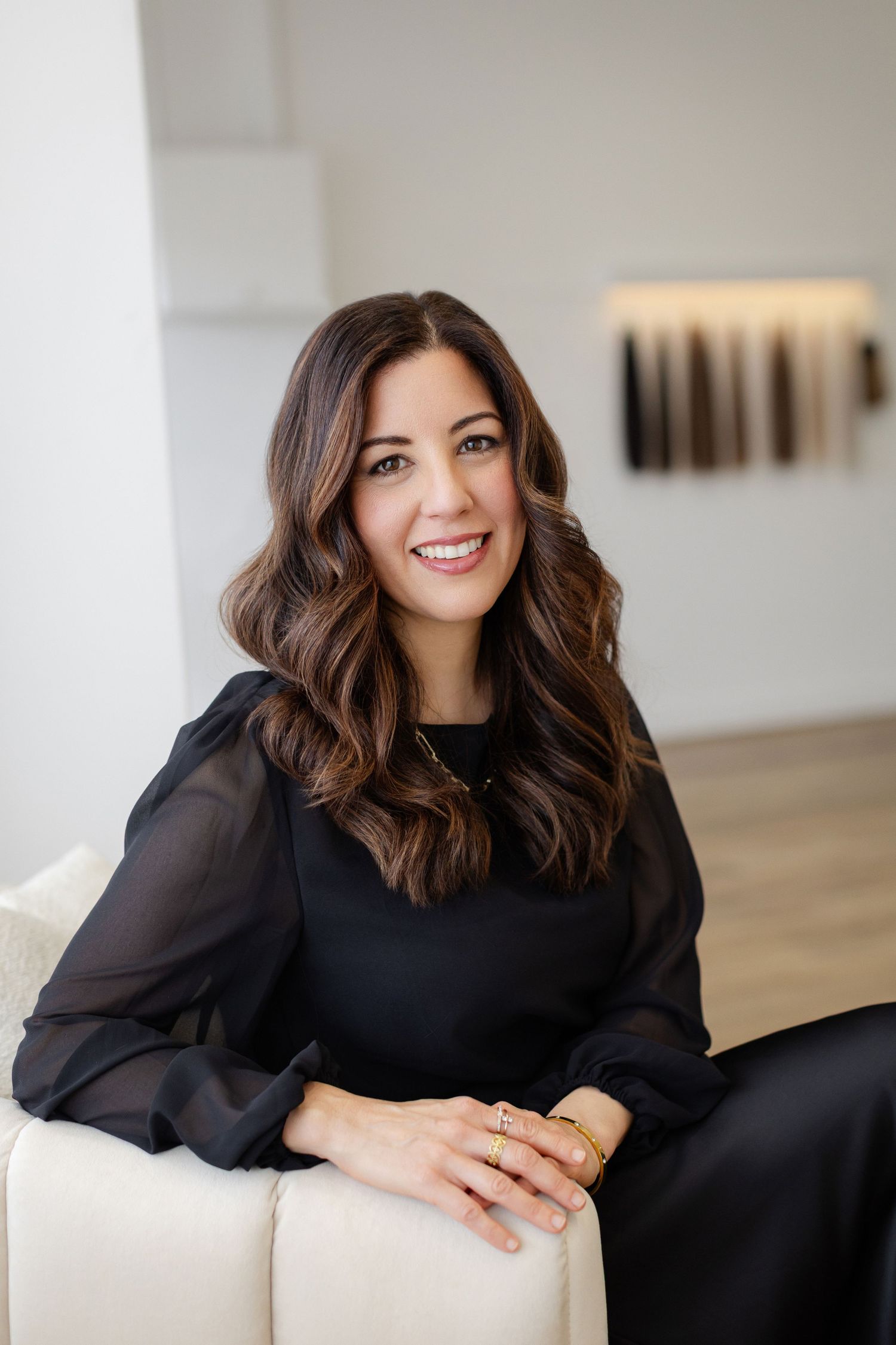 Professional headshot series of a woman in a black top smiling, mobile photography business branding sessions