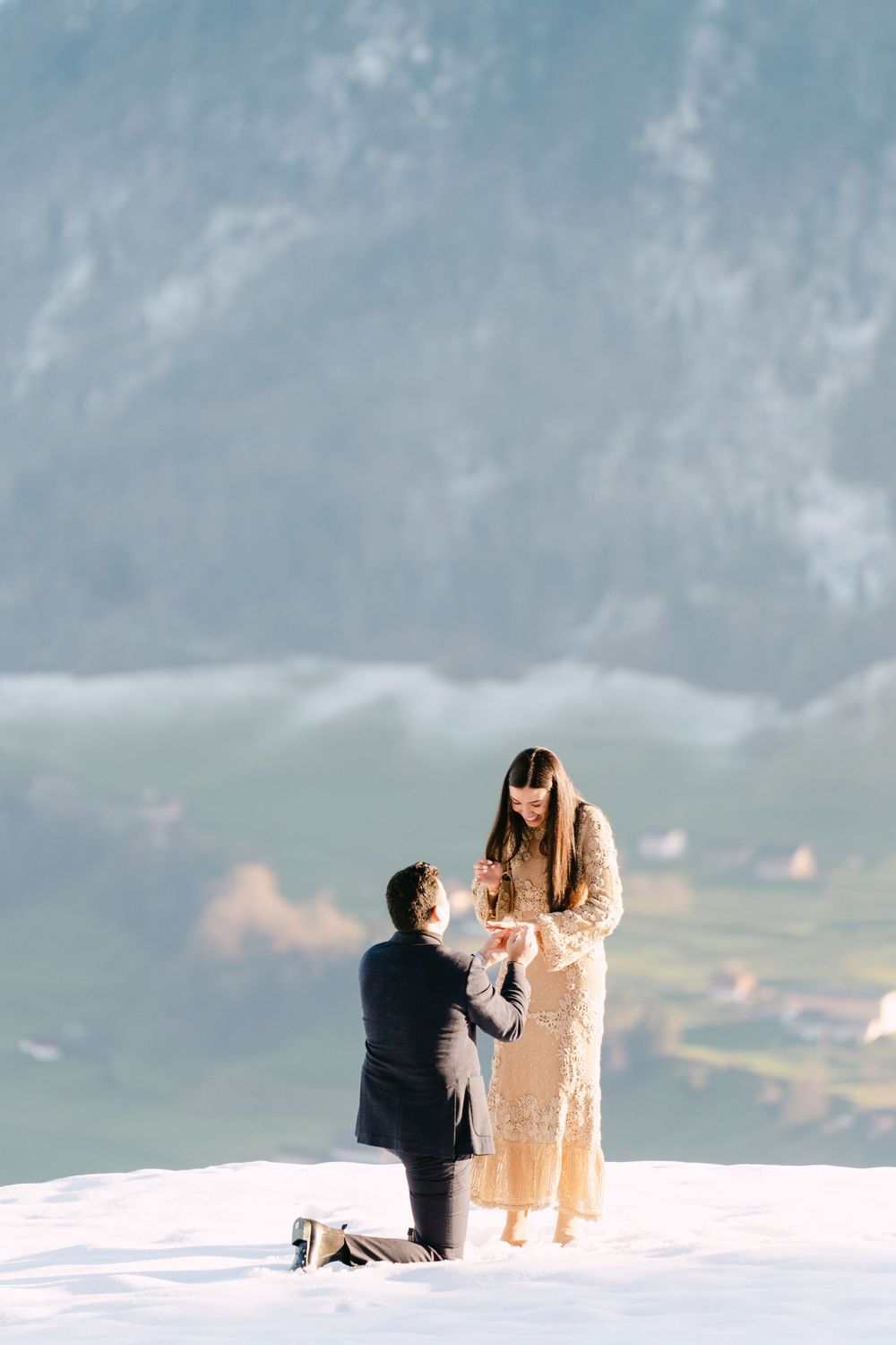 A sequence of photos showing a marriage proposal on a snowy mountain peak with scenic views in the background in Lucerne.