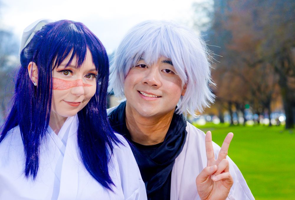 A group of cosplay photos showing people with colorful wigs posing together in an outdoor park setting.