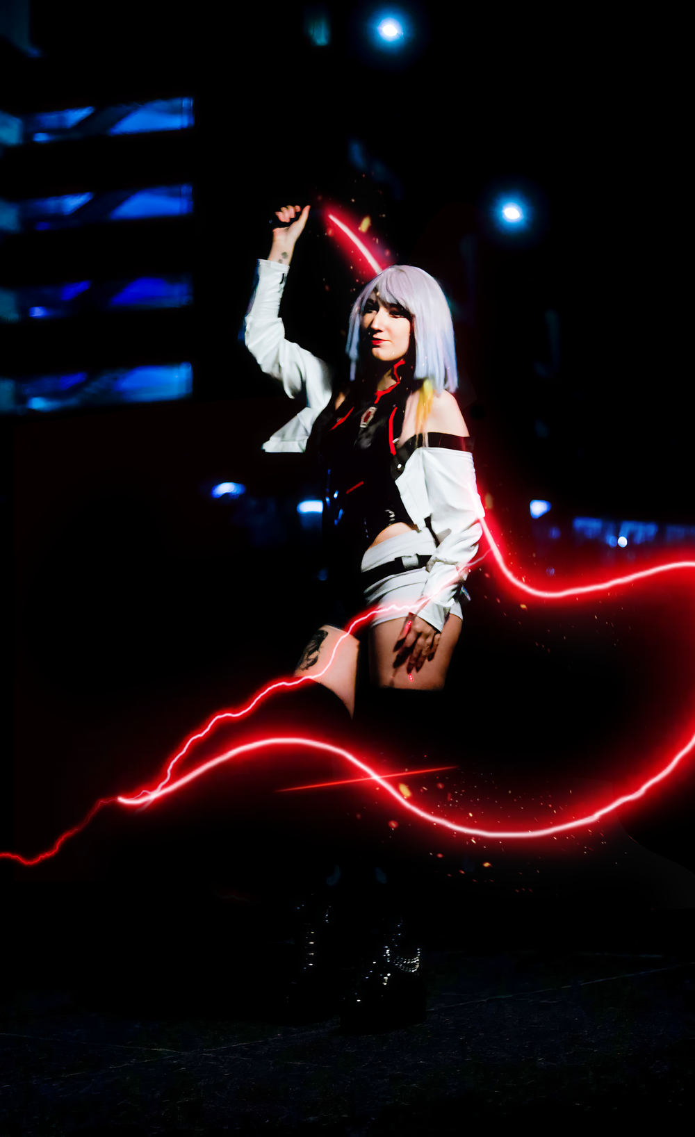 A series of long exposure photographs capturing red light trails against a dark background with a figure in white clothing.