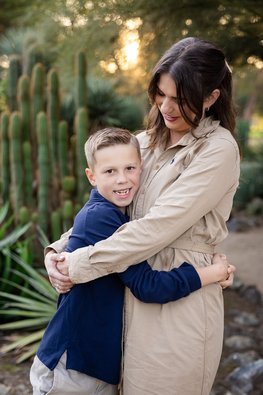 A mom and child have a tender hug while at their family photoshoot in the Bay Area