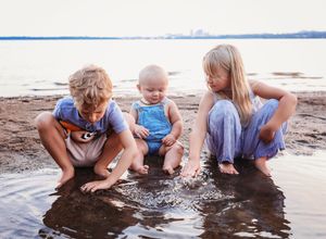 Three children playing in the mud and water next to river looking at each other

Best small child photographer, Peoria, IL.