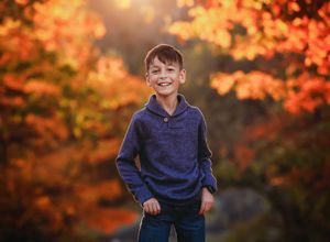 Child in fall scenery smiling at camera in blue shirt

Best child photographer, Peoria, IL.