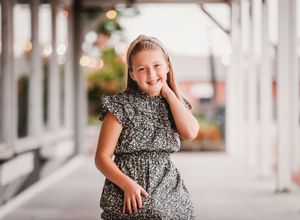 Child on porch smiling at camera with her hand on her neck

Best child photographer, Peoria, IL.