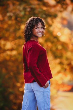 Senior in red smiling back at camera in a fall area

Best senior photographer, Peoria, IL.