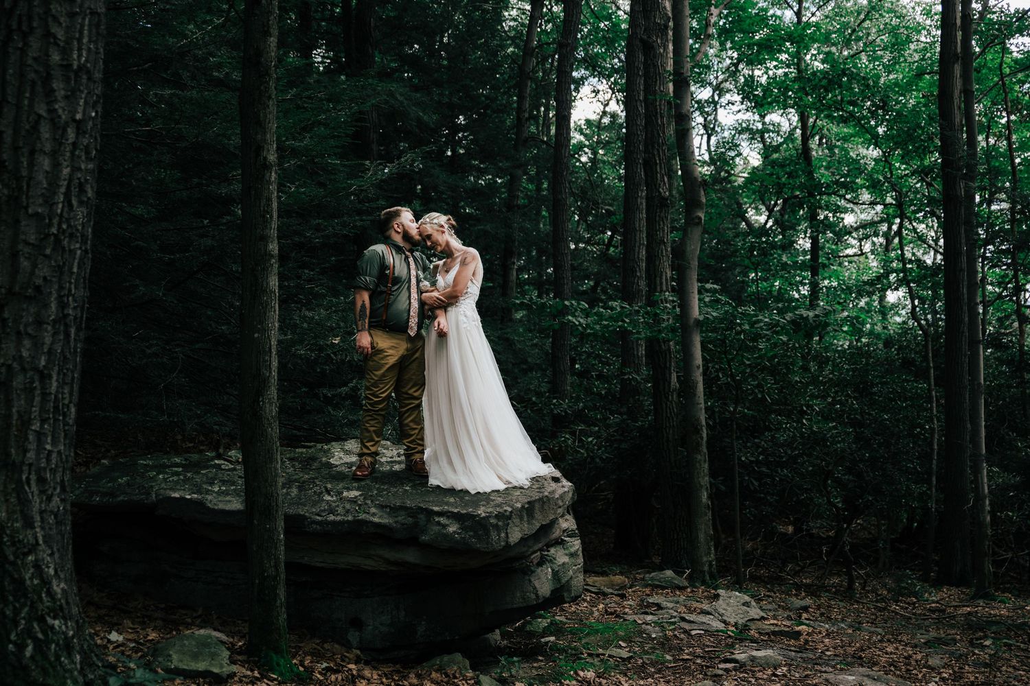 Couple pose on rock at Coopers Rock State Forest in Morgantown, WV