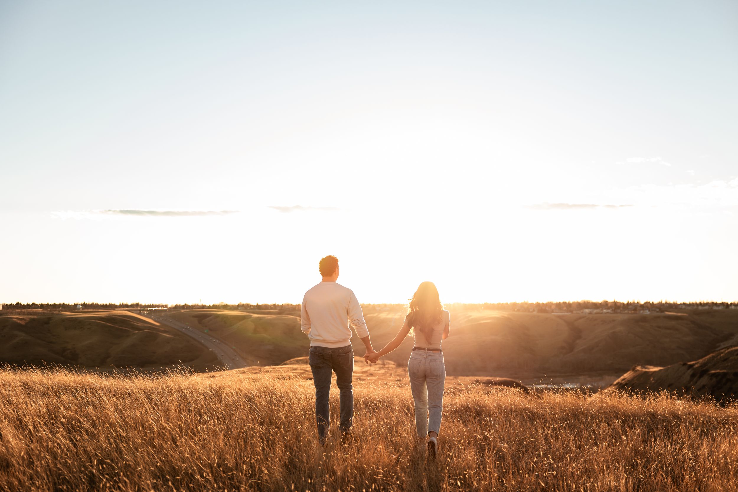couple walking away during sunset