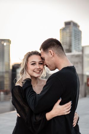 girl looking at the camera and guy looking at his girl