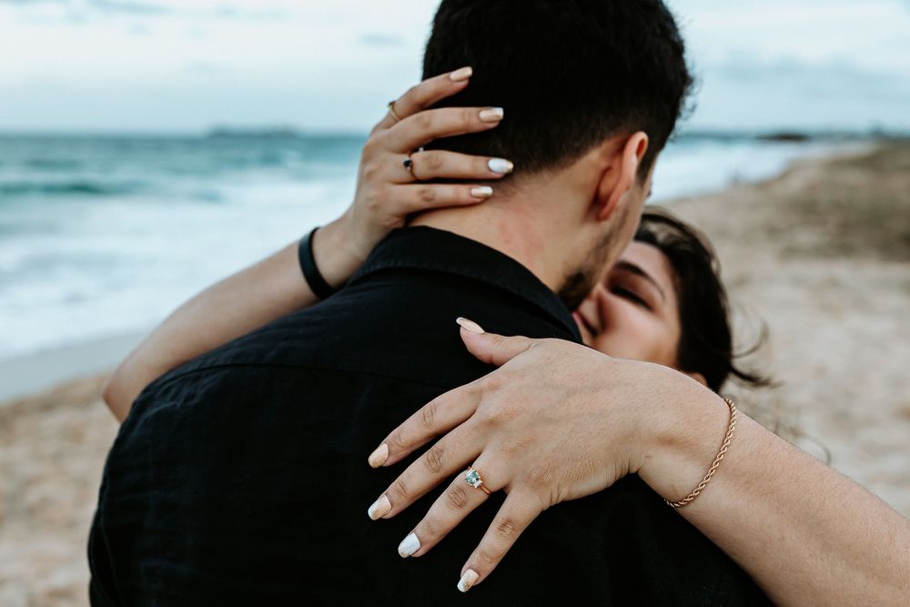 Surprise proposal photography session at sunset golden hour overlooking Mudjimba beach on the Sunshine Coast.