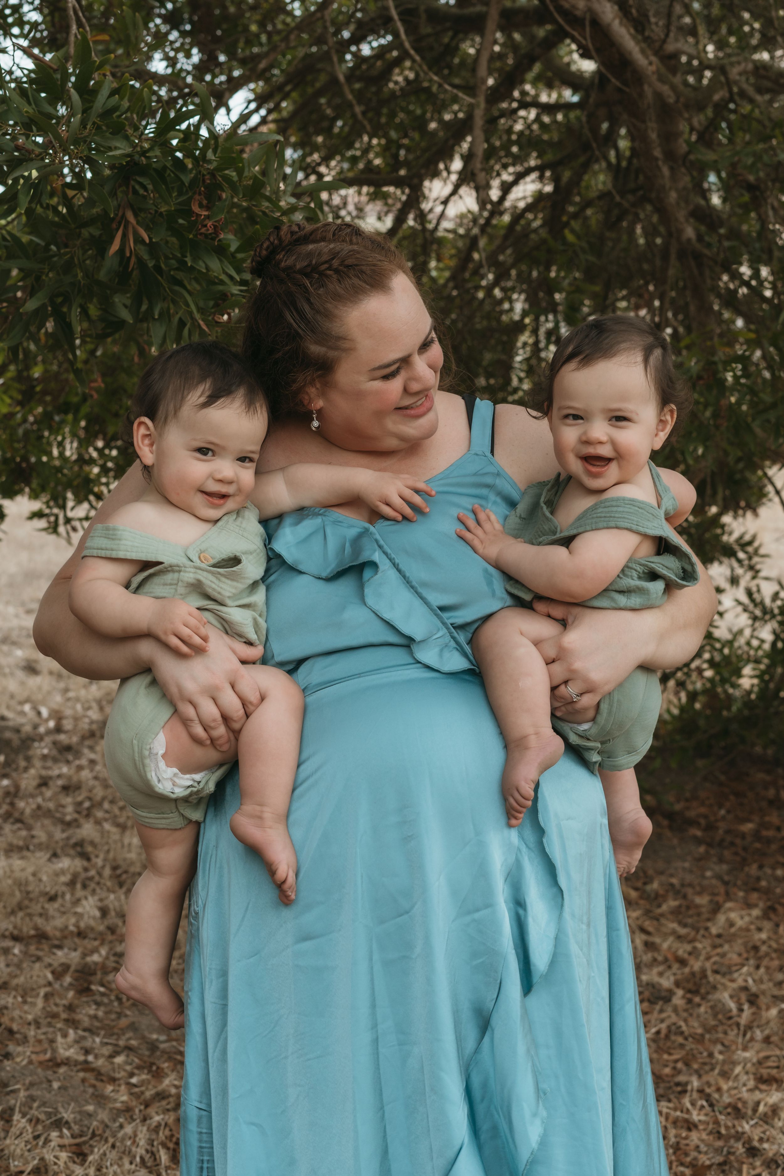 A tender moment captured in a series of photos showing parent and baby in matching mint green outfits outdoors.