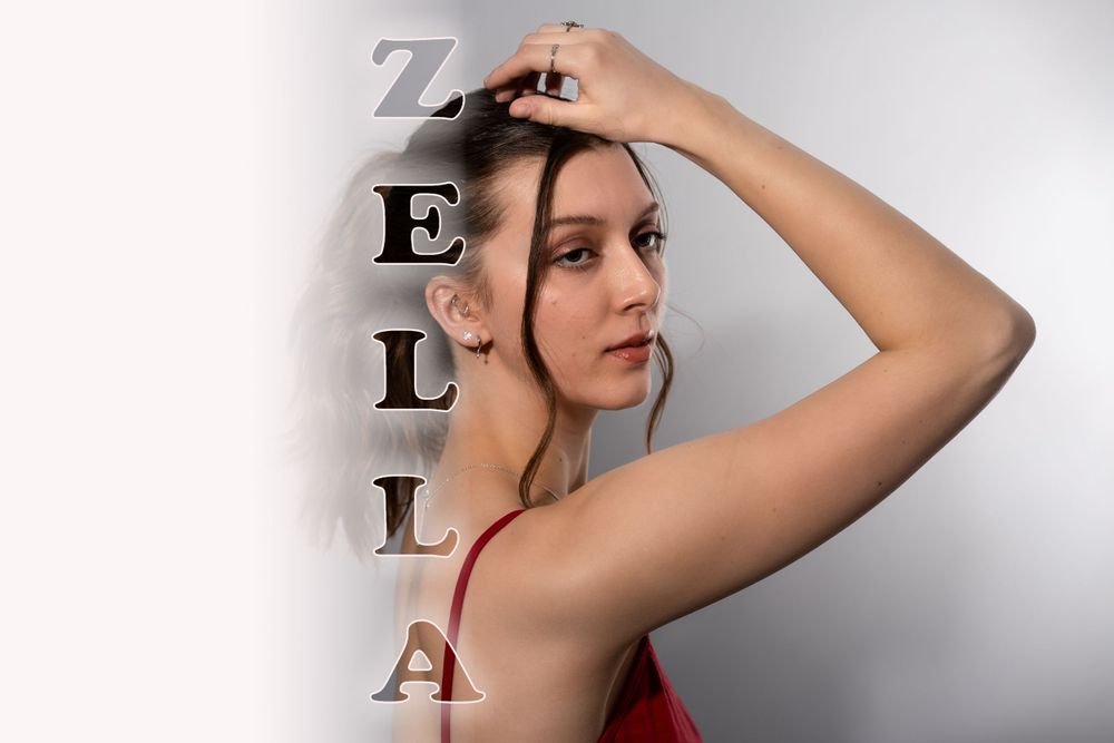 Artistic portrait with vertical text spelling ZELLA against light background.