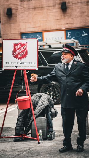 Salvation Army red kettle stand with traditional holiday donation setup.