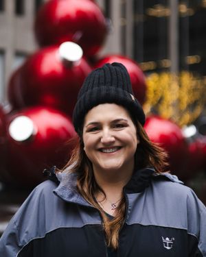 Winter scene with holiday decorations and red ornaments in urban setting.