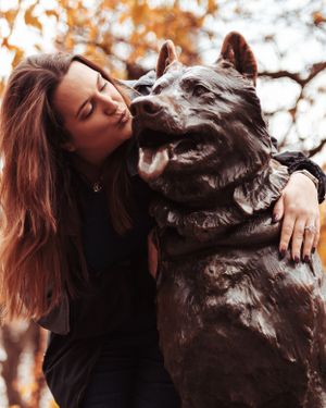 Close up shots of a bronze dog sculpture with textured details.