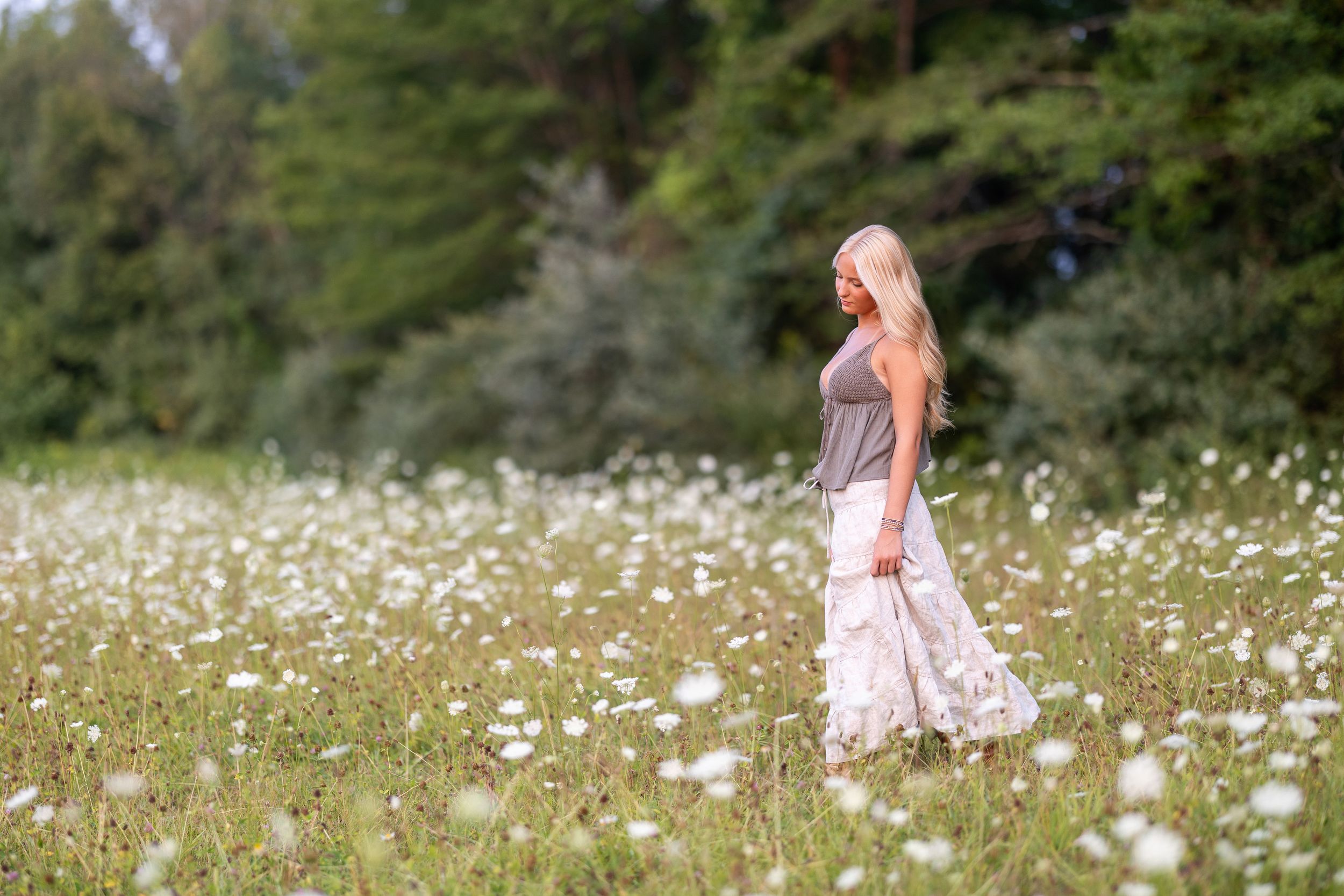 High school senior portrait in a wild flower field in NH