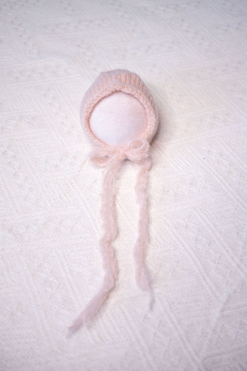 pink baby bonnet