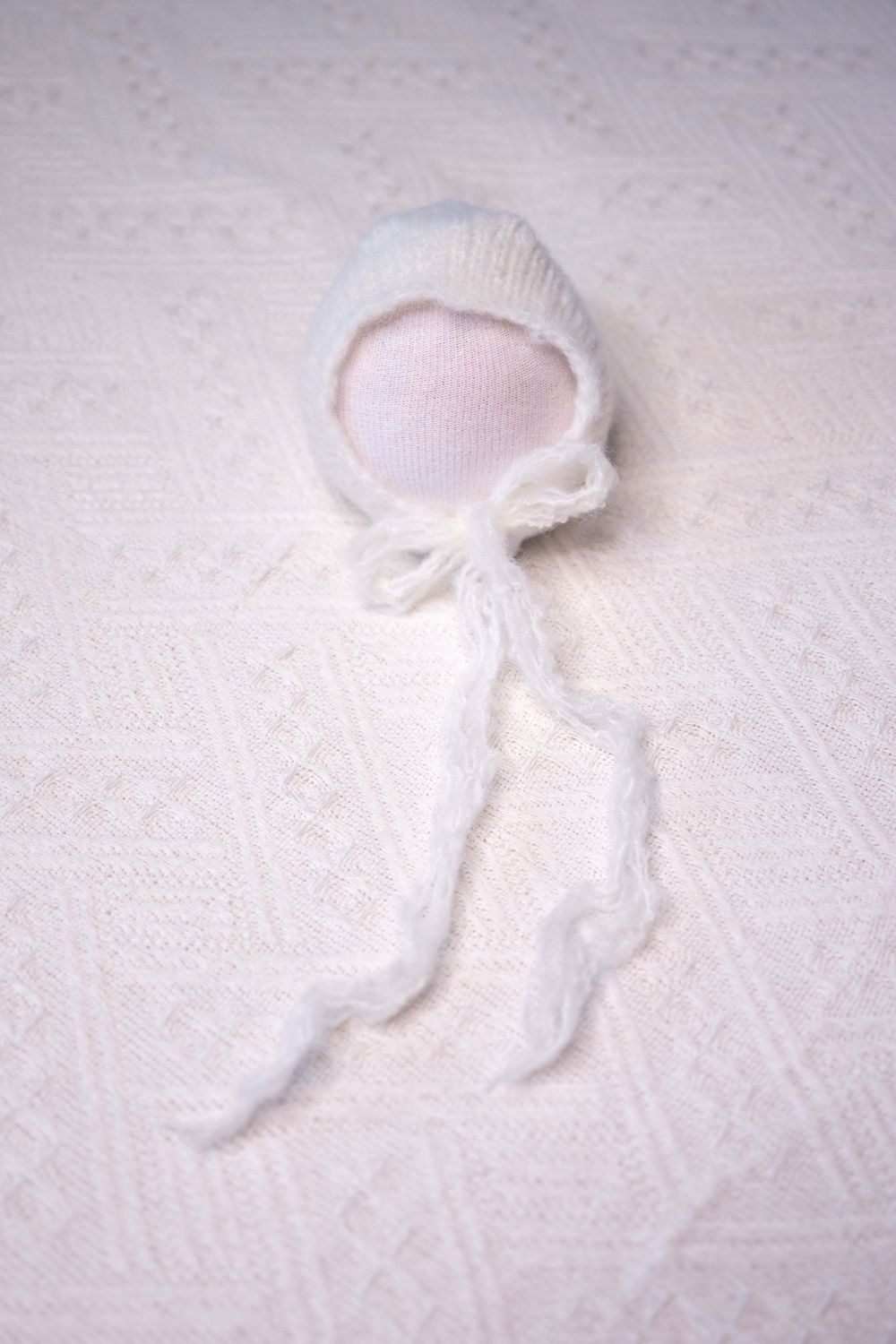 white baby bonnet