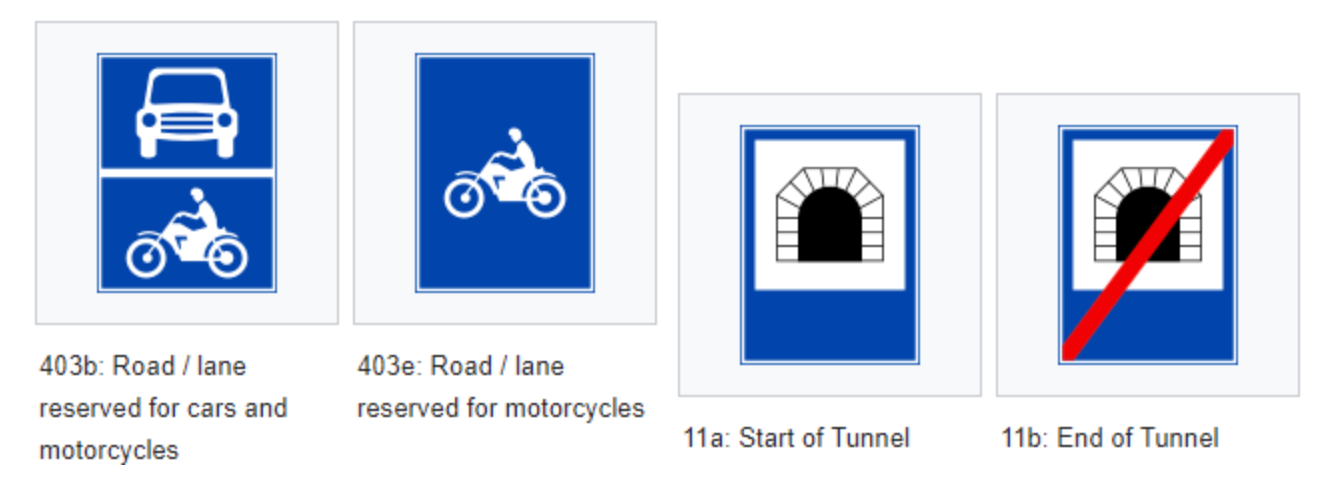 Transportation signs indicating reserved lanes for vehicles and motorcycles, plus tunnel entrance and exit markers.