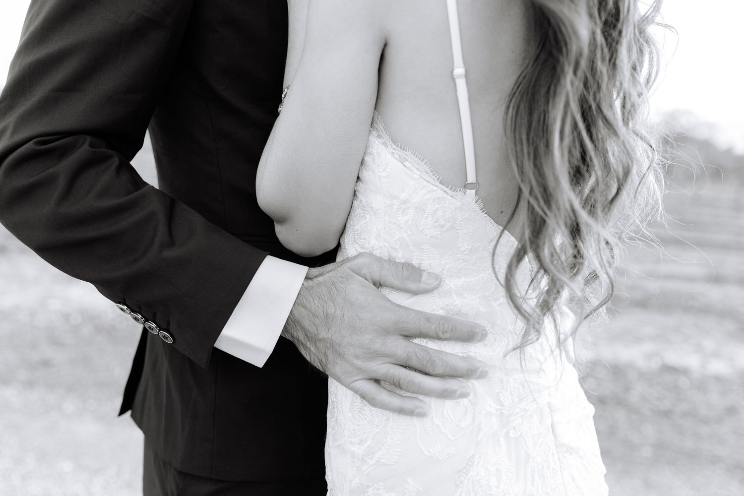 A romantic black and white photo series showing close embraces and tender moments between a couple in formal attire.