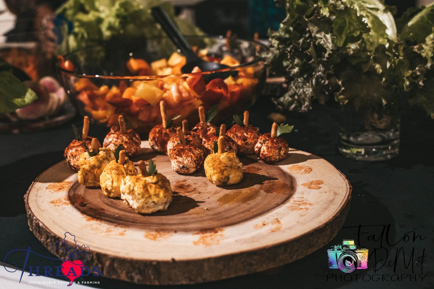 Gourmet appetizers beautifully plated on a wooden serving board with ambient lighting.