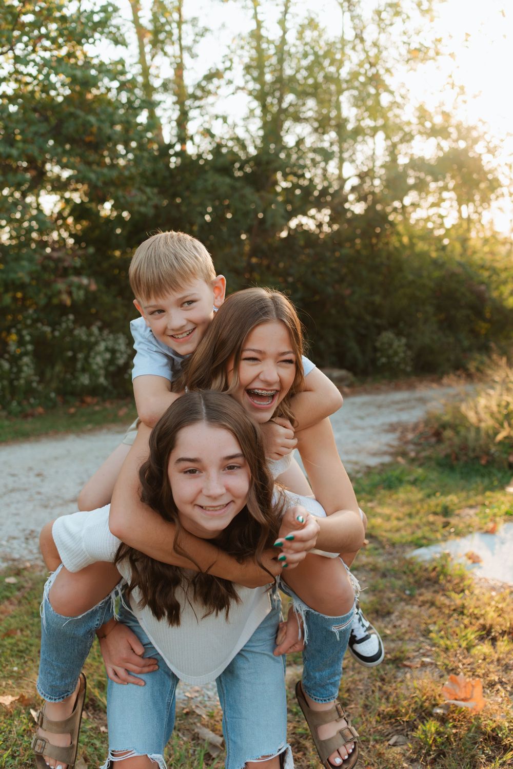 Joyful piggyback rides during a sunset family photoshoot.