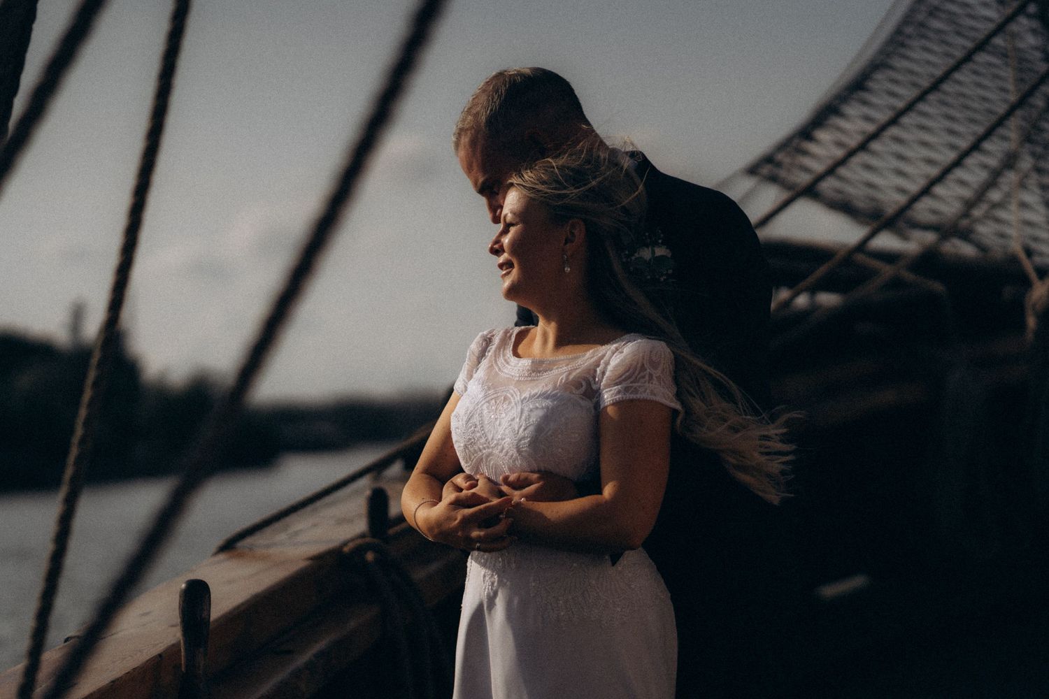 wedding portraits on the boat during golden hour