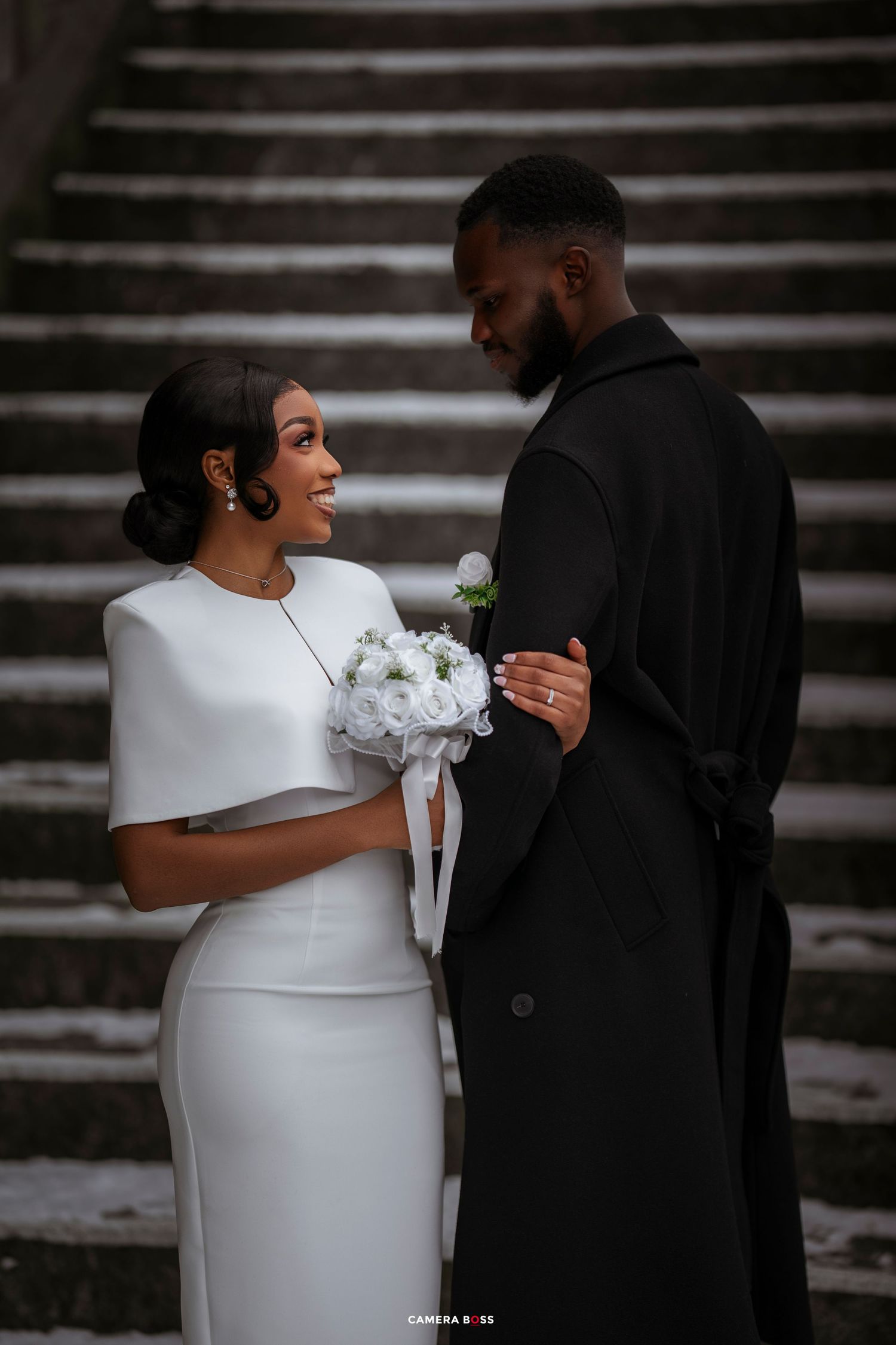A romantic wedding photo sequence showing a couple in white dress and black suit embracing on stone steps.